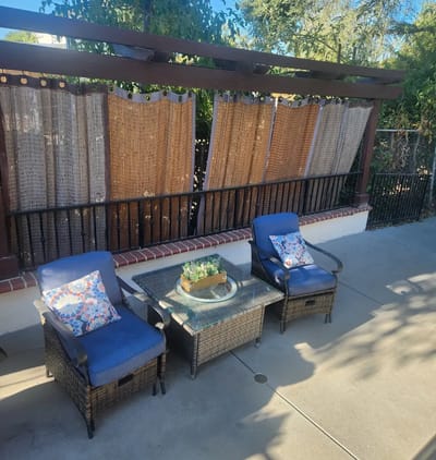 Outdoor seating area with chairs and decor