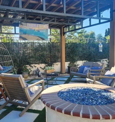 Outdoor seating area with a fire pit in a garden