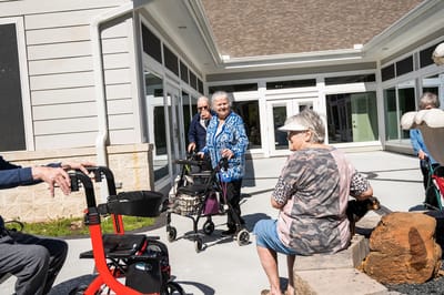 Residents enjoying time outside in a garden area
