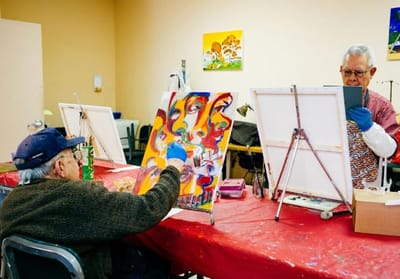 Residents participating in an art activity at a table