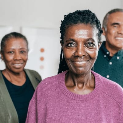 Residents smiling in a common area