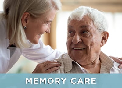 A caregiver interacting with a resident in a warm environment