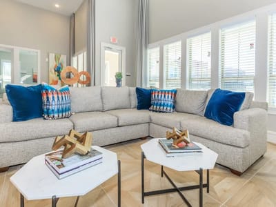 Bright common area with a comfortable couch and decor