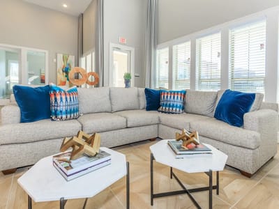 Common area with a cozy sofa and decorative pillows