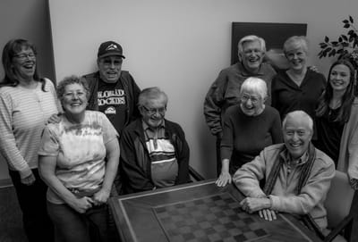 Residents enjoying a game together in a common area