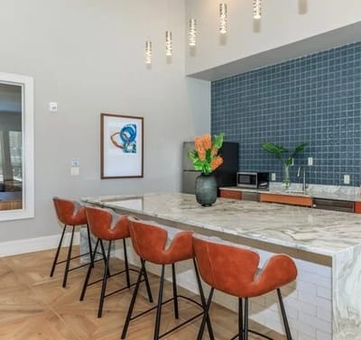 Stylish common area with seating and kitchen space