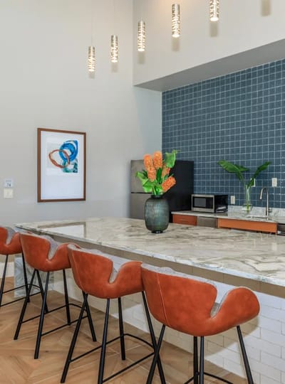 Interior view of a modern kitchen space with seating