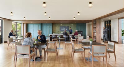 Residents enjoying a meal in the dining area