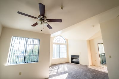 Bright interior view of a living room with windows
