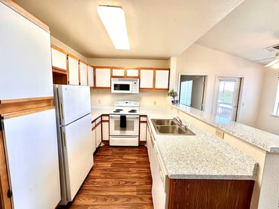 Bright kitchen area with modern appliances