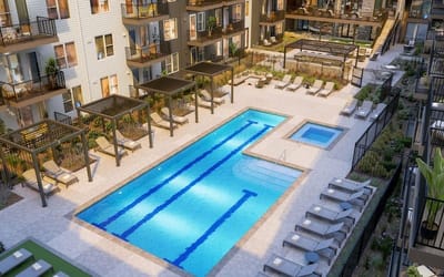 Aerial view of a swimming pool surrounded by lounge chairs