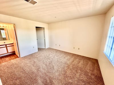 Private resident room with carpet and natural light