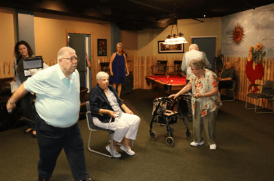 Residents participating in an indoor activity session