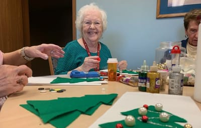 Residents engaged in a holiday craft activity