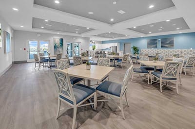 Bright and modern common area with tables and chairs