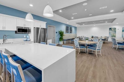 Bright and modern common area with seating and tables