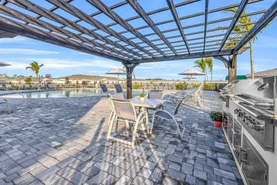 Outdoor seating area by the pool with amenities