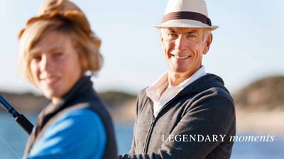 Two people fishing at a beach