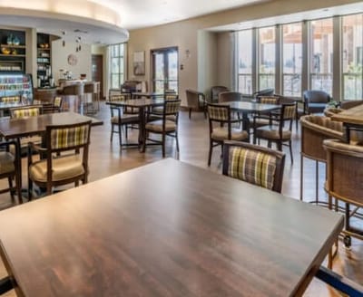 Bright dining area with tables and chairs