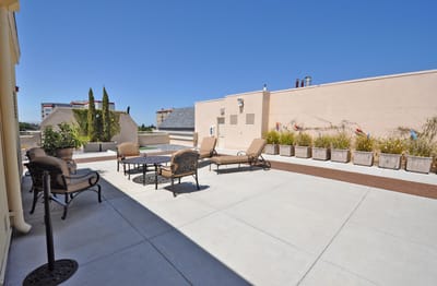 Outdoor seating area with patio furniture and gardens
