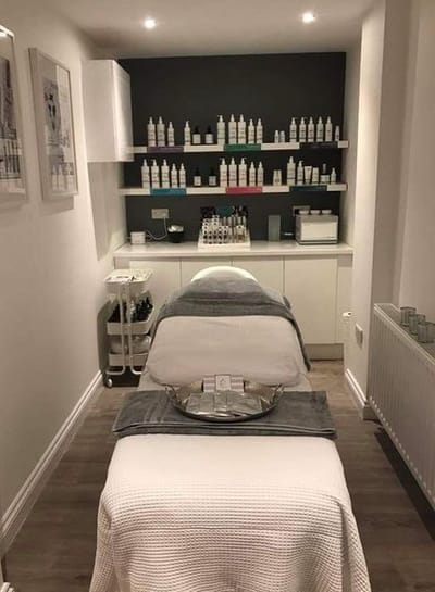 Bright spa room with skincare products displayed