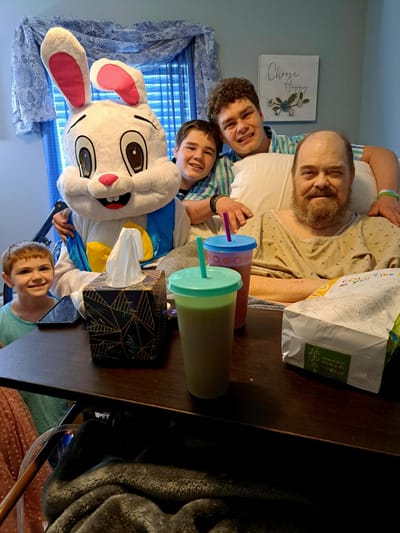 Residents and visitors enjoying a special event with a mascot