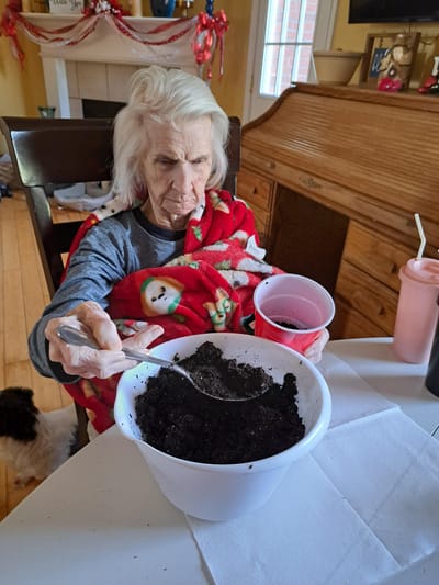 Resident engaged in an activity with soil