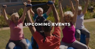 Residents participating in a group exercise activity outdoors