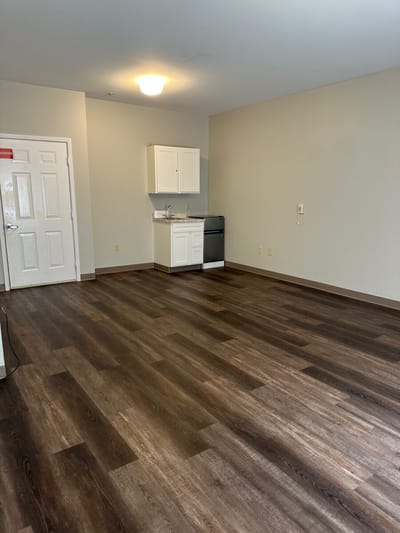 Empty resident room with a kitchenette