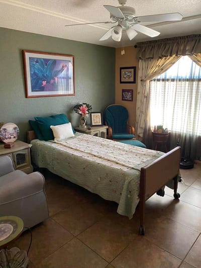 Cozy resident bedroom with a bed and seating area