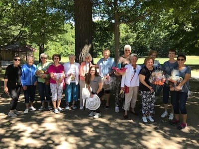 Residents and staff enjoying an outdoor group activity