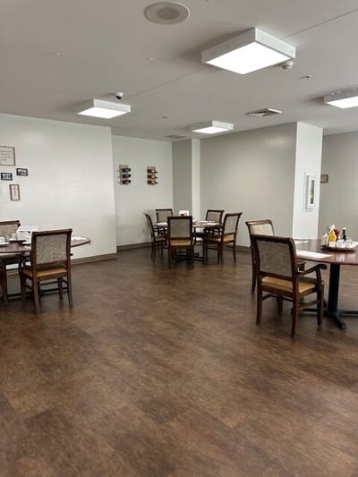 Interior of a dining room with tables and chairs