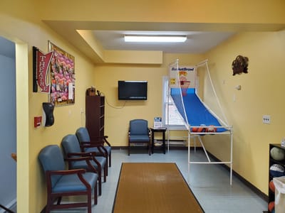 Interior activity room with seating and game