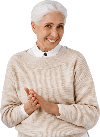 Riverside Manor, nursing home in Ames, IA — Smiling senior woman in a cream-colored sweater