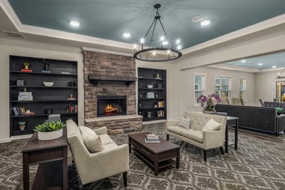 Interior common area with seating and a fireplace