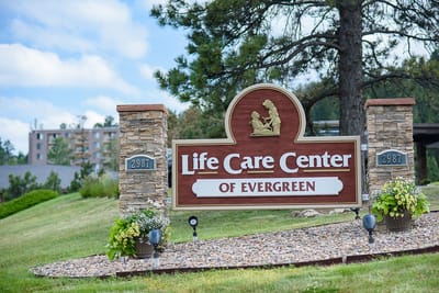 Exterior sign of Life Care Center of Evergreen facility