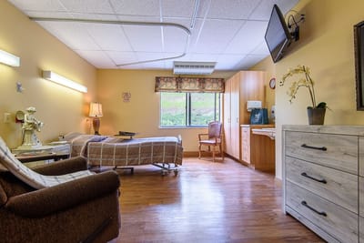 Bright interior of a resident's room with two beds