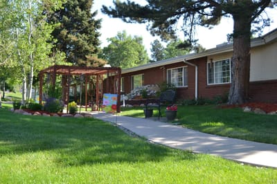 Well-maintained outdoor space with walkways and seating area