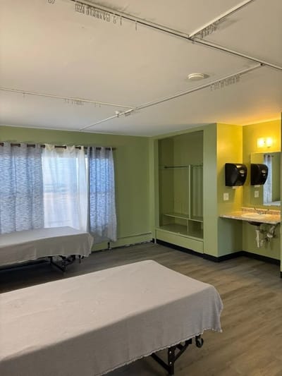 Interior view of a room with beds and storage
