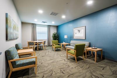Bright common area with seating and decor