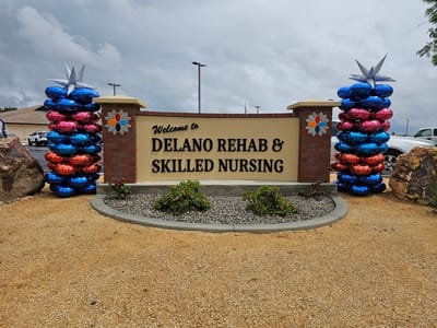 Sign welcoming guests to Delano Rehab & Skilled Nursing