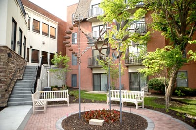 Outdoor garden with seating and sculpture