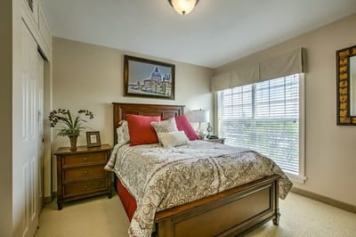 Cozy bedroom with a double bed and window view