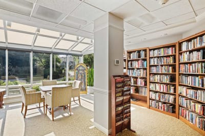 Bright common area with bookshelves and seating