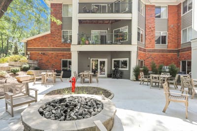Outdoor patio area with seating and fire pit