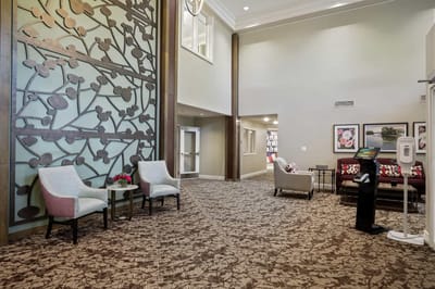 Interior of a common area with seating and decorative wall