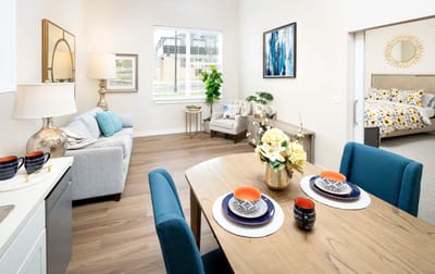 Bright interior of a shared living space with a dining area