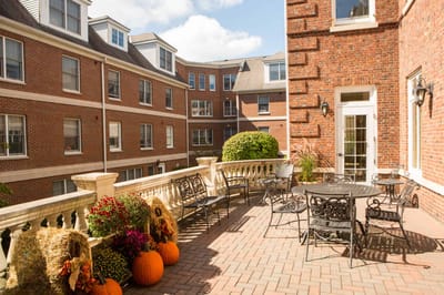 Outdoor patio area with seating and seasonal decorations