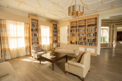 Bright common area with bookshelves and seating