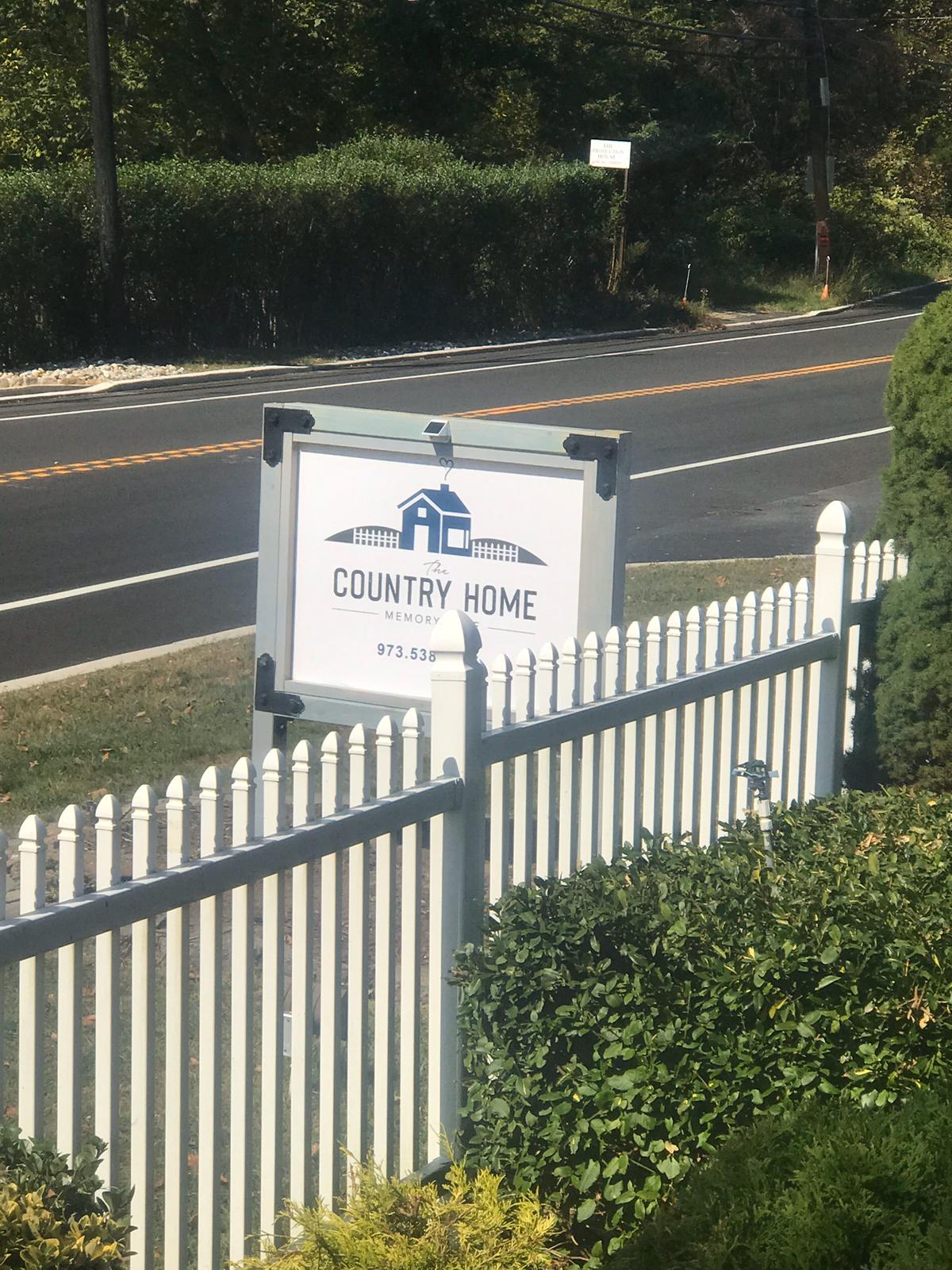 Exterior view of The Country Home sign by the road